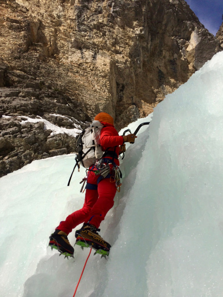 Climbing the ice route Ghoster Coaster in Cougar Canyon, Canmore, AB